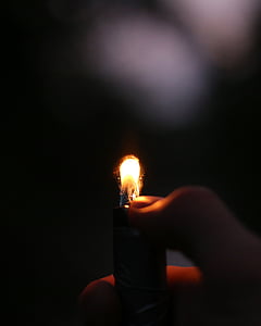 shallow, focus, photography, person, holding, lighter, fire