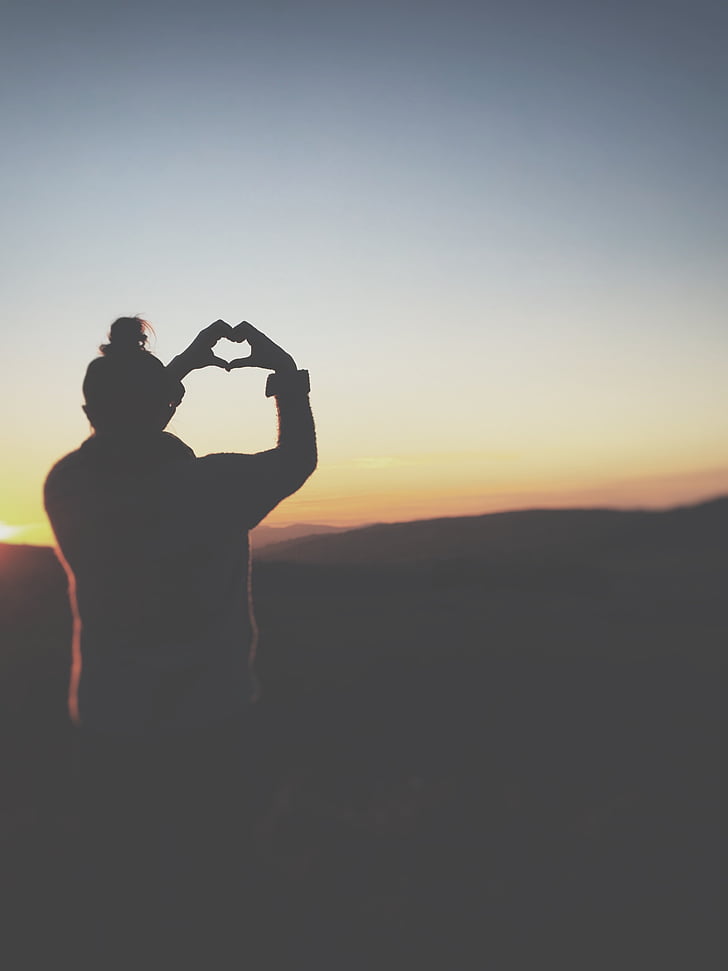 silhouette, photograph, person, standing, holding, heart, hand