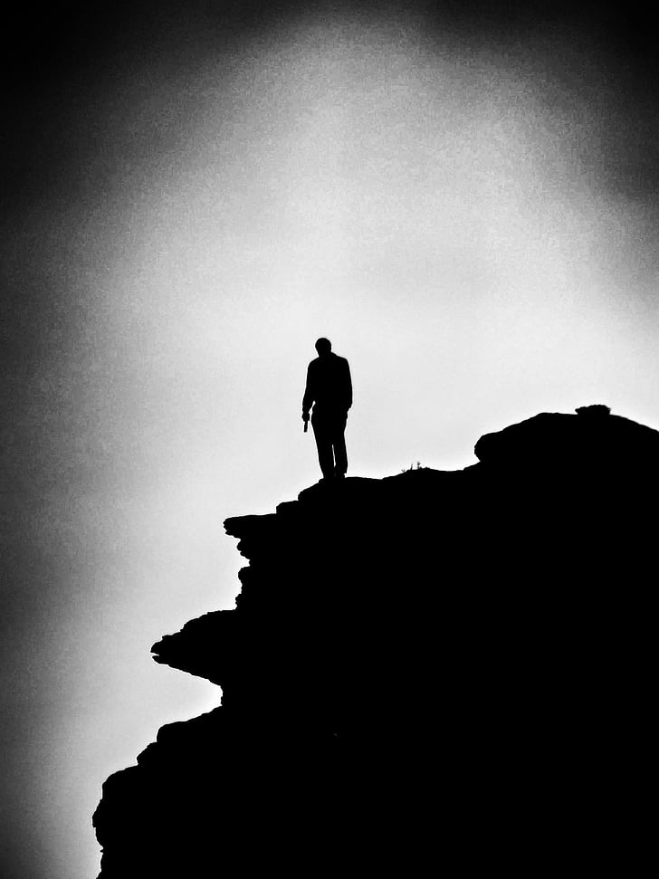 loner, alone, man, rock, standing, black and white, b w