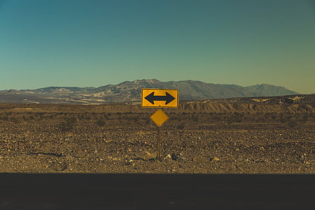 arrows, barren, direction, mountains, road, road sign, outdoors