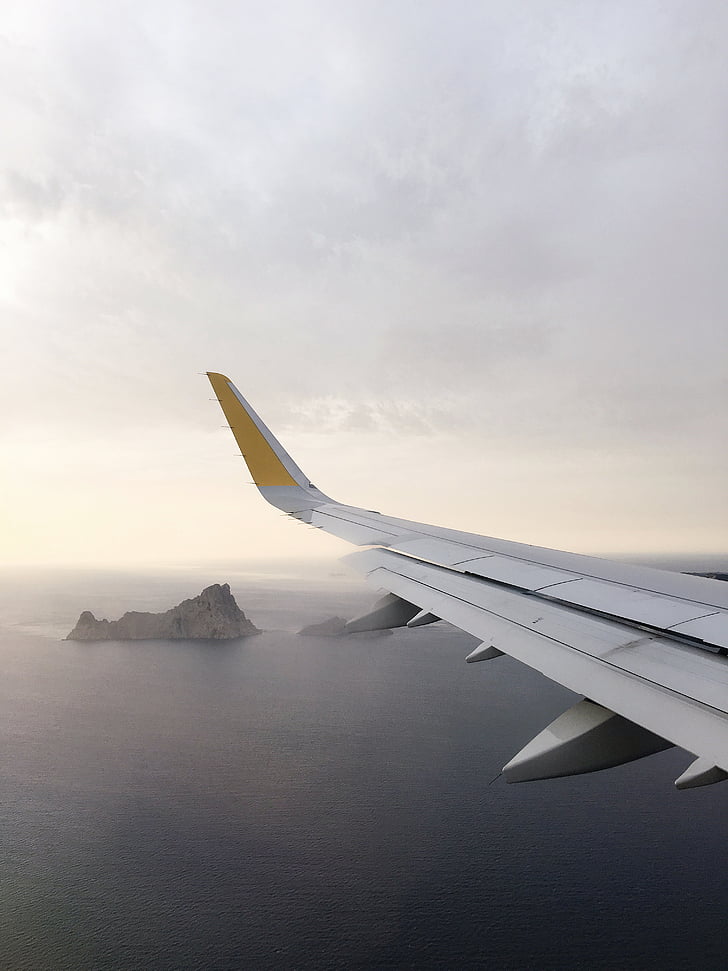 person, taking, photo, white, yellow, airplane, wing