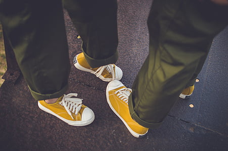 person, wearing, yellow, white, low, top, sneakers