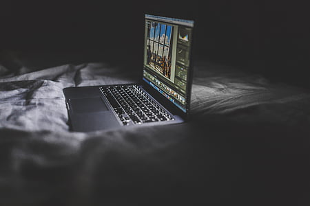 turned, grey, black, laptop, computer, macbook, bed sheets