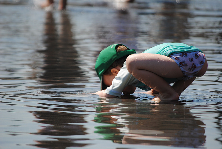 child playing in water, toddler in summer, child, summer, toddler, fun, happy