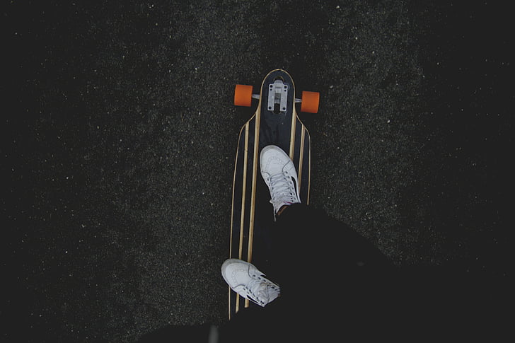 person, black, pants, white, sneakers, riding, longboard