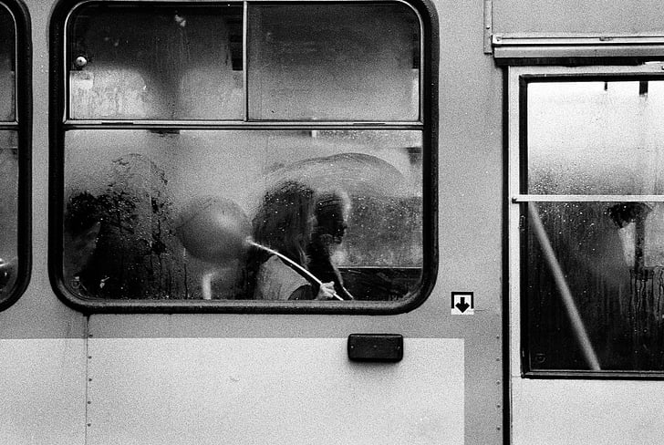 grayscale, photo, person, train, door, girl, rain