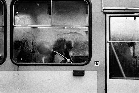 grayscale, photo, person, train, door, girl, rain