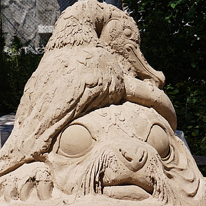 sculpture de sable, oeuvre d’art, fait de sable, oiseaux et grands yeux