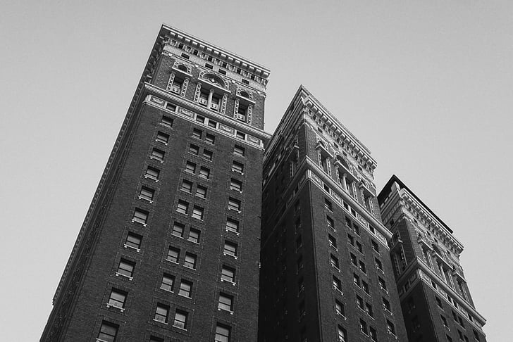 grayscale, low, angle, photo, three, high, rise