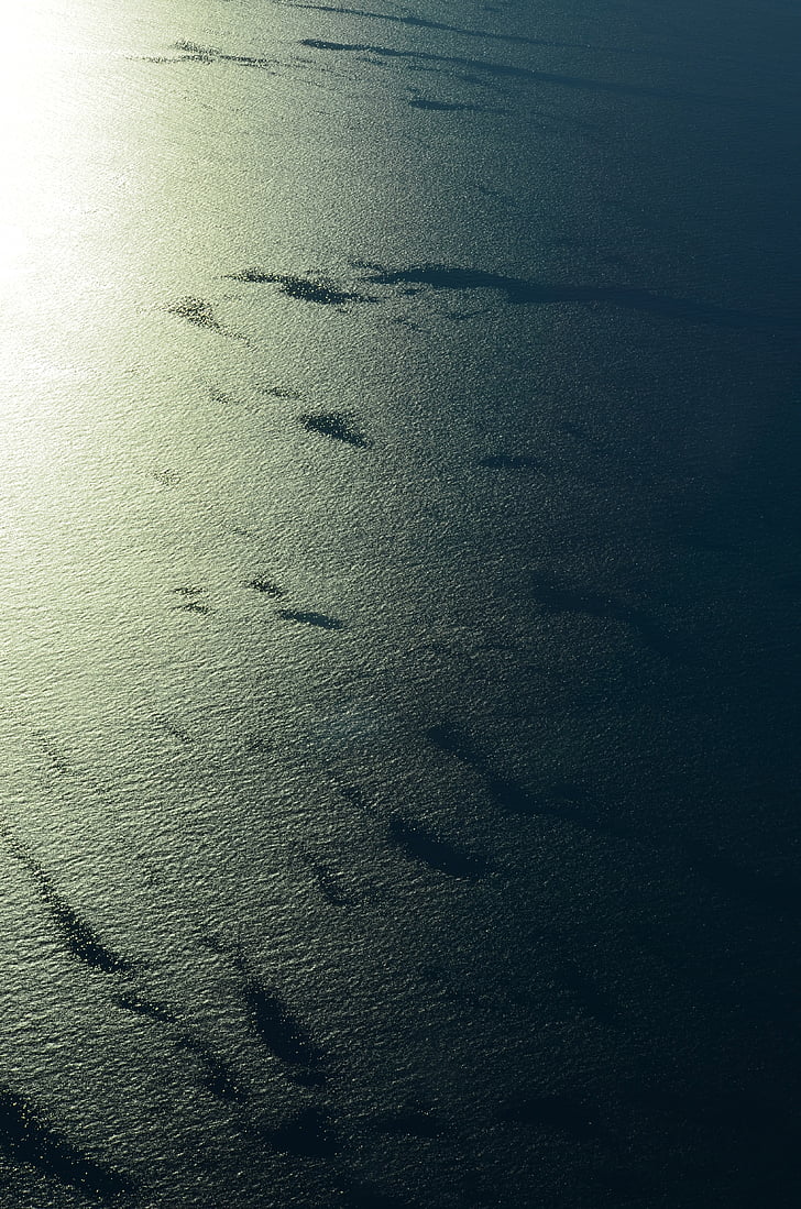 Mar, superfície llisa, des de l'avió, l'aigua, oceà, ones, posta de sol