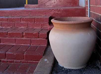 pot, clay, large, cream colored, terracotta edge, red steps, red brick wall