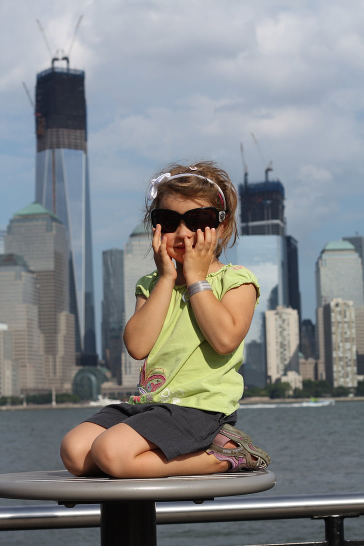 the little girl, new york, glasses, the construction of the wtc, child, a child presenting with glasses, city