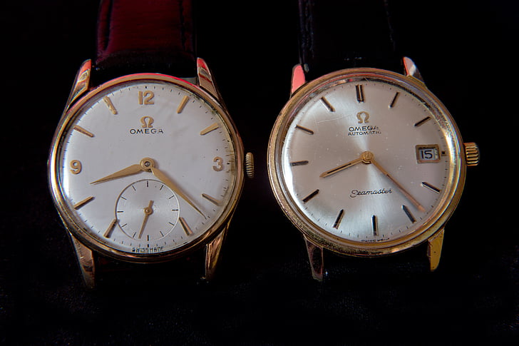 wrist watches, old, hard worn, gold case, pearl finished faces