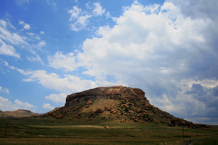mountain, butte, rocky, flat top, sun light, green slopes, veld