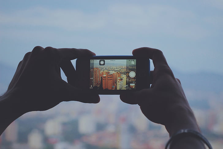 human, holding, black, iphone, taking, photography, city