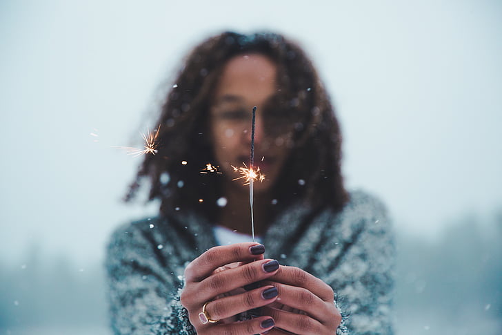 woman, wearing, gray, coat, holding, sparkler, snowtime