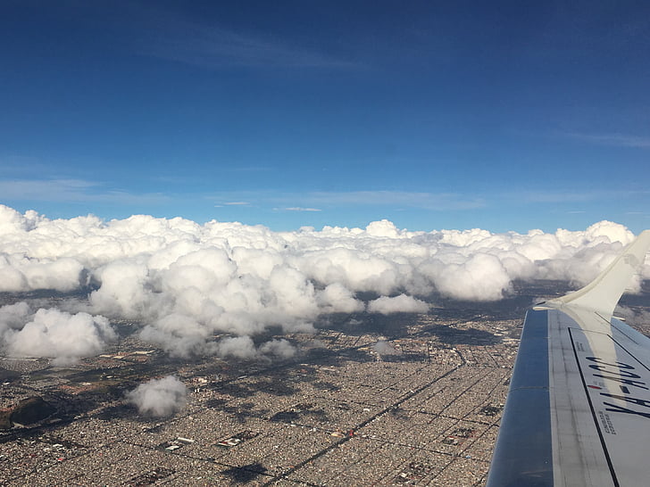 cloud over city, flight, wing, sky, city, plane, travel