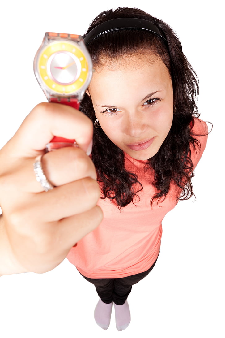woman, wearing, pink, shirt, holding, silver, wristwatch