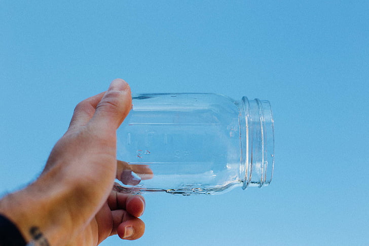 bottle, clear, close-up, container, empty, fingers, focus