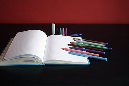 colored pens, coloured pens, markers, notebook, paper, table, book