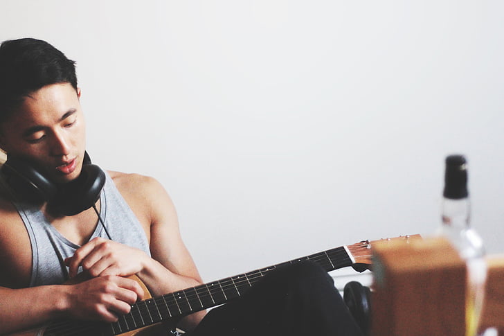 man, playing guitar, instrument, headphones, earphones, person, play
