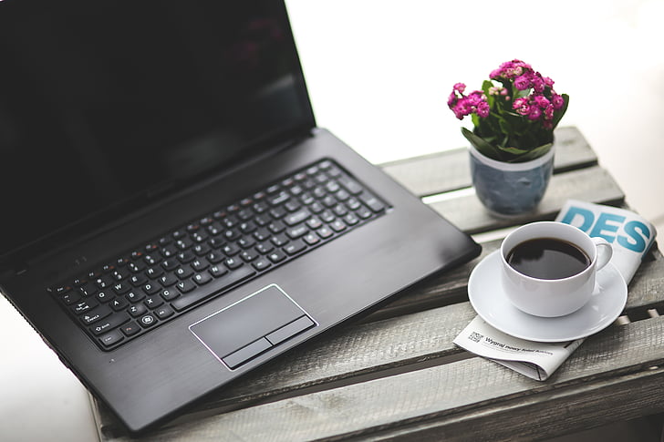 black, laptop, computer, beside, white, ceramic, teacup