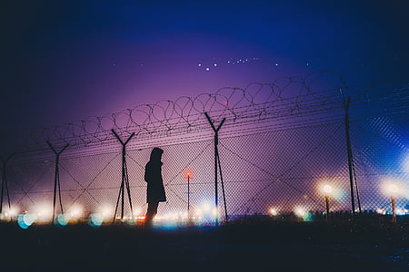 woman, standing, beside, fence, dark, night, sky