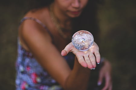 person, holding, round, clear, plastic, component, crystal ball