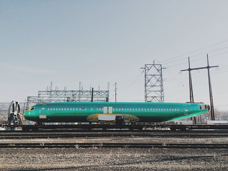photo, teal, airplane, trailer, industrial, train tracks, power lines
