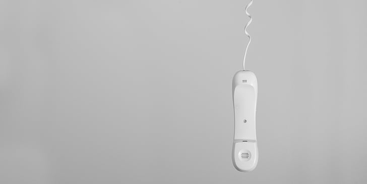 conceptual, black and white, telephone hanging, close-up, no people, indoors, hanging
