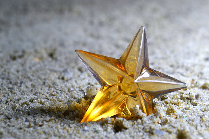 star, yellow, toy, small, standing, ground, sand