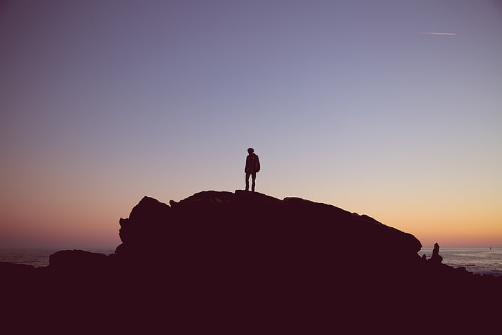 silhouette, man, standing, rock, formation, near, sea