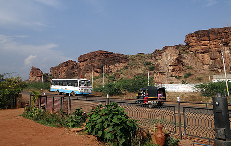 badami, rocks, sand stone, red, cliff, road, bus