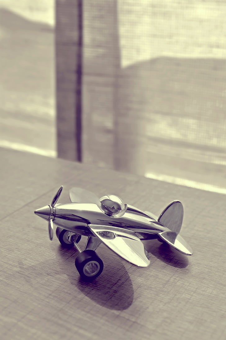 airplane, biplane, black-and-white, decoration, gray, indoors, metal