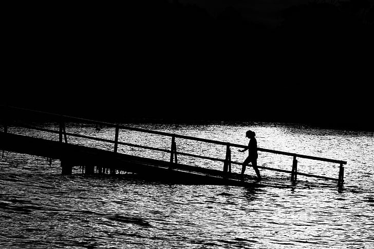 silhouette, woman, walking, bridge, towards, body, water