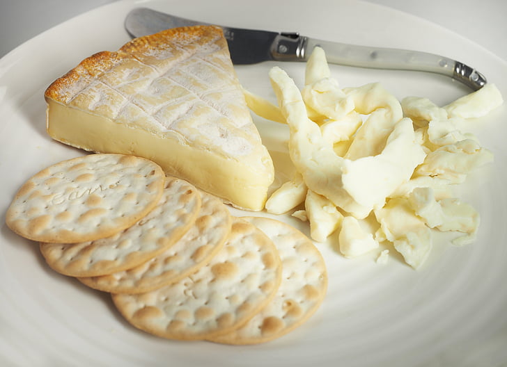cheese, brie, curds, cracker, knife, white, plate