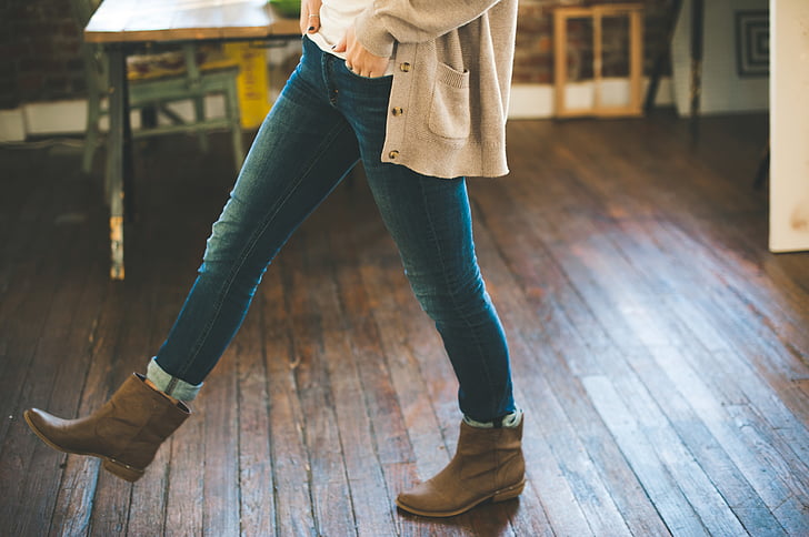 person, wearing, brown, leather, booties, blue, jeans