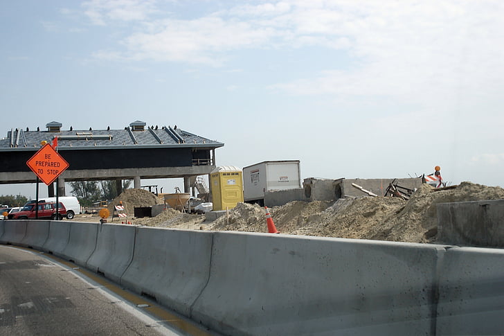 under construction, construction, toll booth, progress, street, building