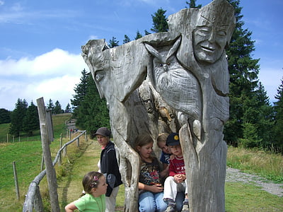 sculpture, log, wood, carving, mask, eagle owl, children