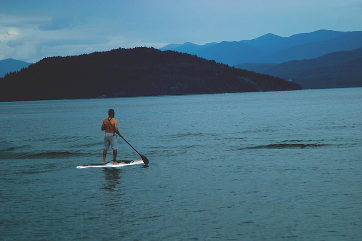 man, stepping, stand, paddle, board, day, lake