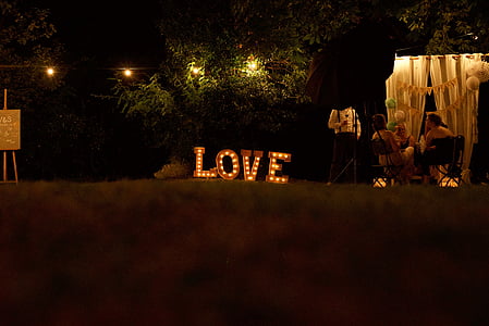 lit, love, standing, letters, beside, people, seated