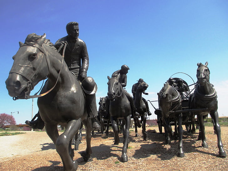 oklahoma sooners display, river walk park in ok, horses, riders, land rush, frontier, historic