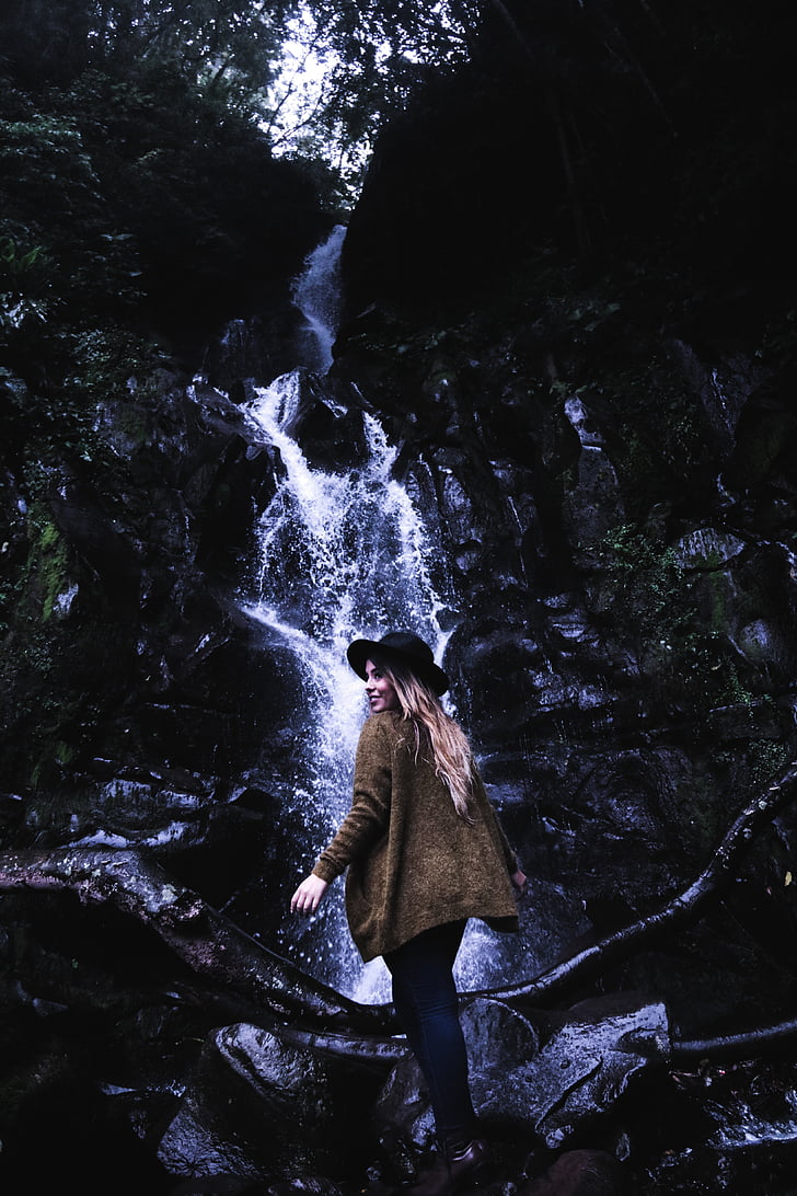 woman, standing, front, water, falls, daytime, waterfall