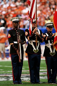 honor guard, sporting event, flags, uniforms, spectators, football stadium, competition