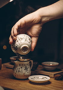 antique, cup, drink, food, hand, hot, indoors