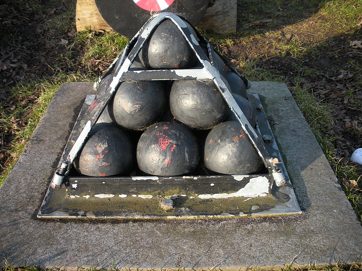 cannon balls, old, bolted, iron pyramid, iron, cement, black