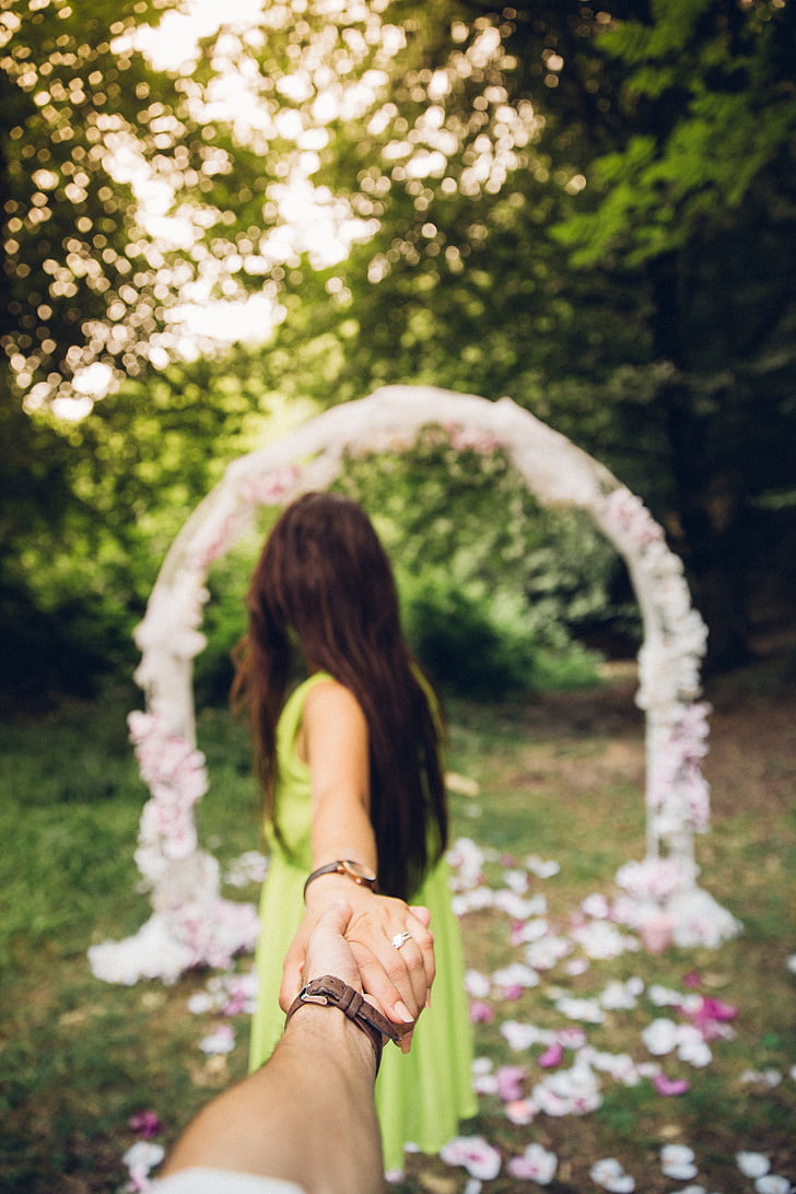 woman, pulling, person, hand, wedding, arch, people