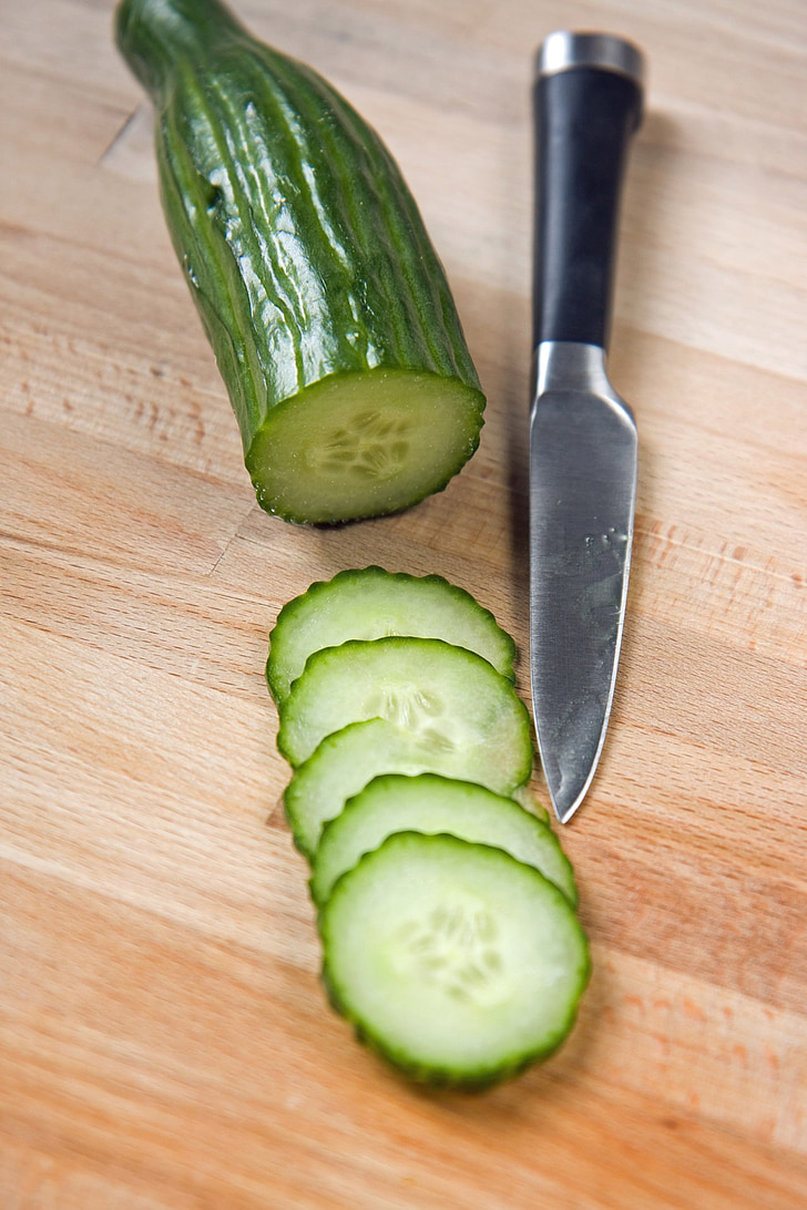 cucumber, slices, sliced, cucumber slices, wooden chopping board, chopping board, wooden