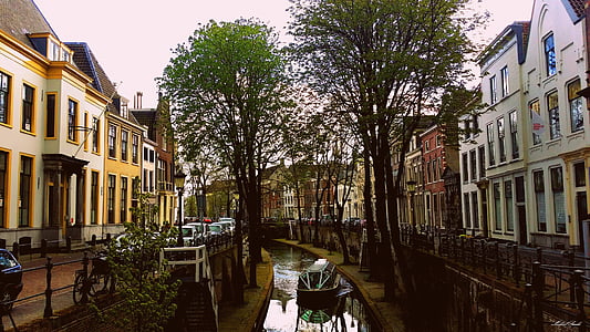 boat, buildings, canal, cars, city, street, town