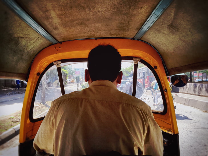 wearing, brown, polo, shirt, inside, auto, rickshaw